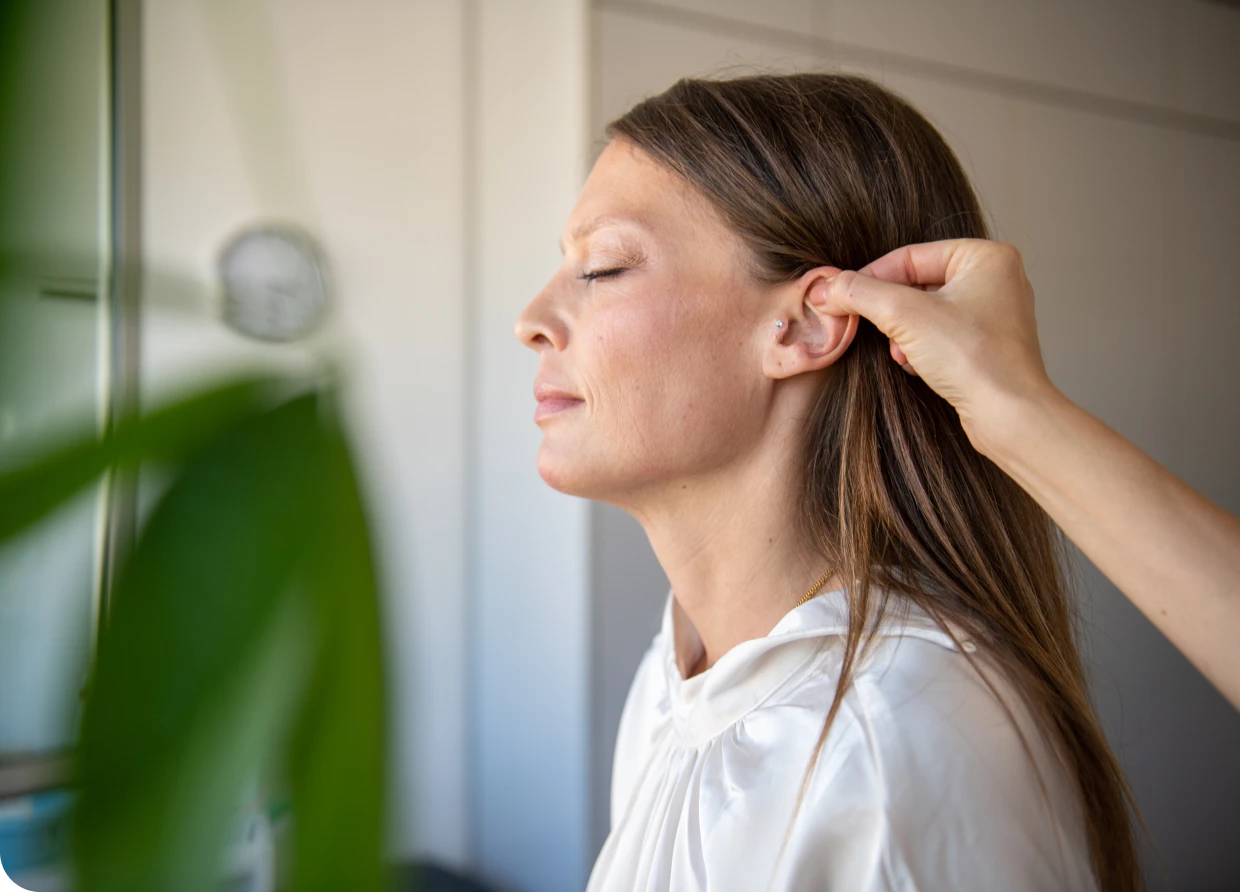 Calming ear massage session indoors